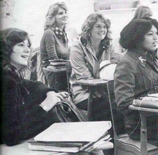b&w photograph of female students at lecture
