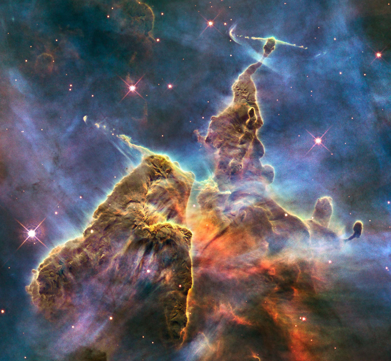 A region of the Carina nebula in the constellation of the same name imaged by the Hubble Space Telescope.  Unceremoniously dubbed Herbig-Haro 901 and 902, the pillars here are a few light years across, each light year being nearly six trillion miles, and contain massive high velocity jets of ionized gas and harsh radiation involved in formation of new stars.  Hubble imagery offers a beautiful visual reference that all can relate to.