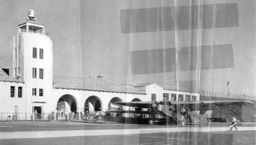 The Grand Central Air Terminal at Glendale, Calif. with a Ford Trimotor parked in front of it