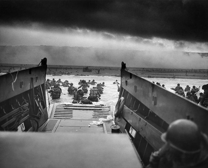 Photo taken by Robert F. Sargent on D-Day. Two thirds of the unit seen disembarking here became casualties during the landing.