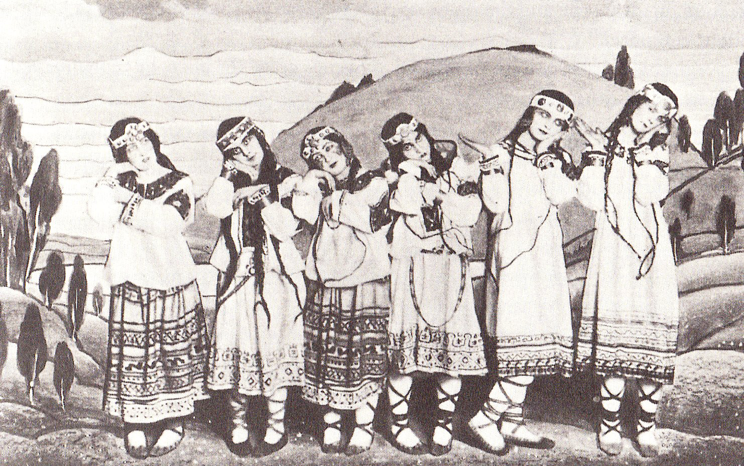 A posed group of dancers in the original production of Igor Stravinsky's ballet The Rite of Spring, showing costumes and backdrop by Nicholas Roerich.