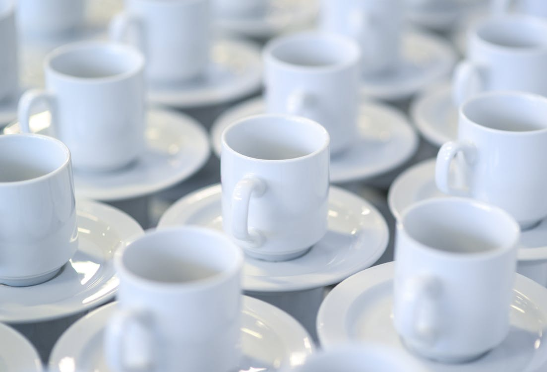 Stacked white coffee cups