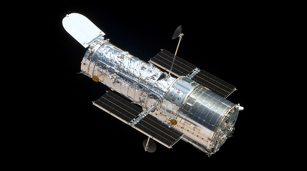 The venerable and ground breaking Hubble Space Telescope, launched in 1990, has been returning astronomical data and imagery that can be only be described as transformative for three decades.  This picture was snapped from the Space Shuttle Atlantis during the fourth and final servicing mission in May of 2009.  By coincidence I was on the International Space Station at the time working on science investigations.  The juxtaposition of human-serviced spacecraft and simultaneous human-crewed research platforms highlights our parallel efforts in space exploration.