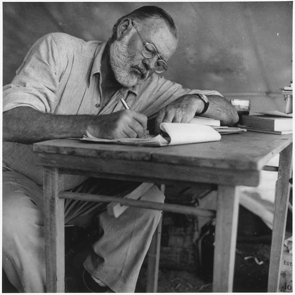 Ernest Hemingway, who often started his novels in longhand, writing while at camp in Kenya.