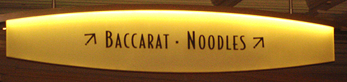sign that reads baccarat*noddles