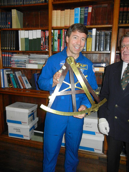 Michael Barrett holding a sextant