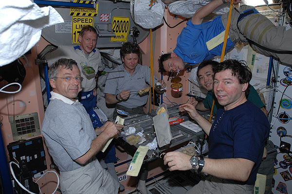 Expedition 20 crew at galley table 