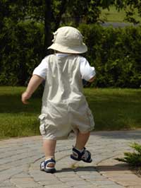 photo of a baby boy walking