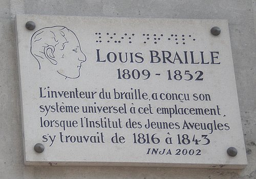 Image of braille plaque in honor of Louis Braille, which can be found in Paris at the intersection of the Rue des Ecoles and the Rue du Cardinal Lemoine, the home of the Royal Institute for Blind Youth from 1816 to 1843