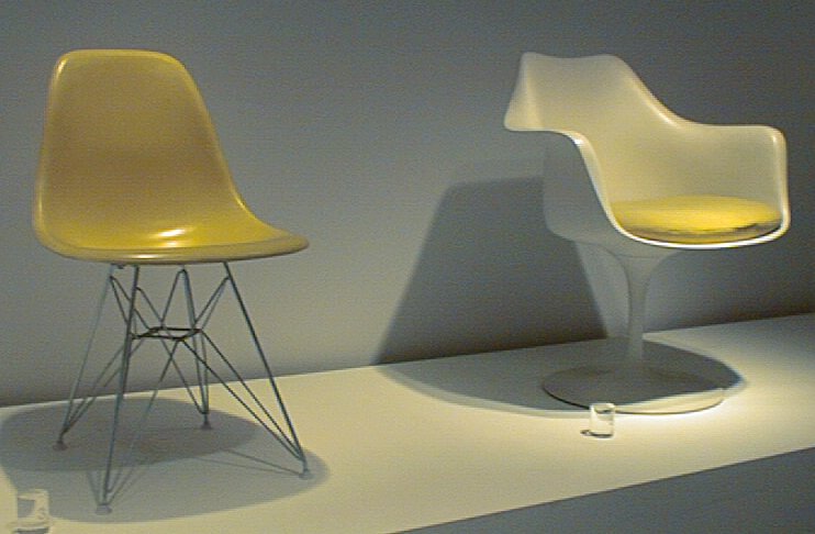 New York Museum of Modern Art displays a late Eames chair on the left and another chair by his mentor Eero Saarinen on the right.