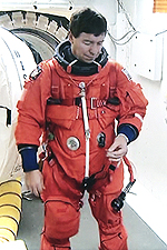 Michael Barratt suiting up in the 'White Room' in front of Discovery's entry hatch -- about to join Discovery on her last journey